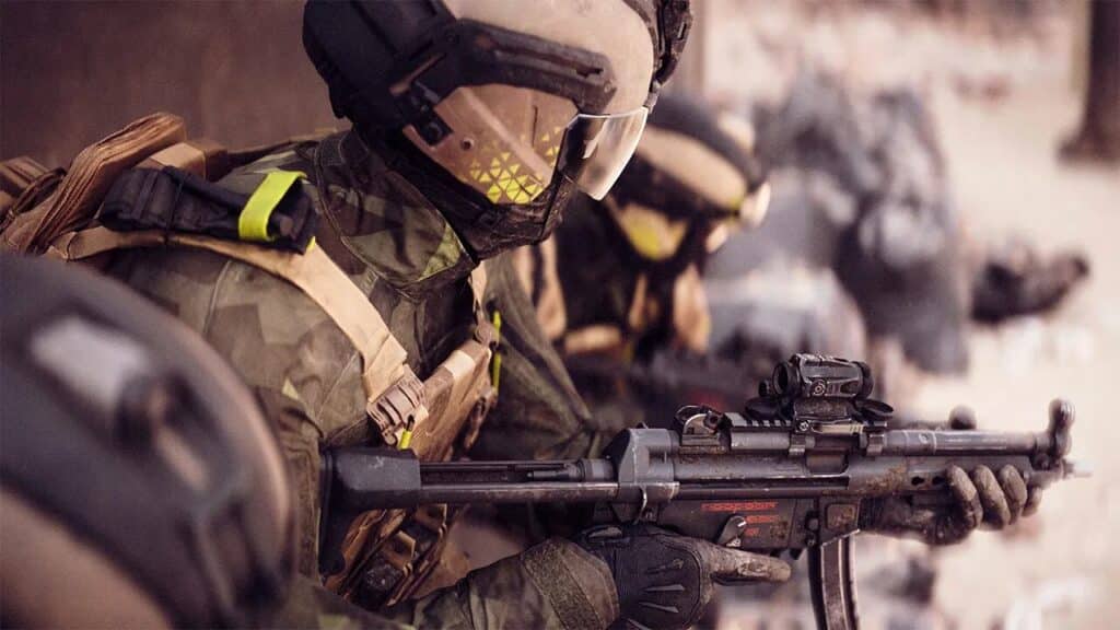 Two soldiers in futuristic armor and helmets crouch, aiming rifles in a rocky, outdoor environment—a scene reminiscent of a Battlefield 6 multiplayer showcase.