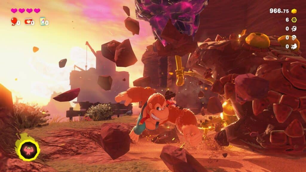 Donkey Kong dashes through a vibrant, rocky landscape at sunset, channeling Donkey Kong Bananza energy as he escapes a towering rock monster.