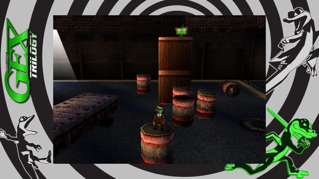 Gex stands on a barrel in an industrial game level filled with crates and barrels, while the vibrant Gex Trilogy logo adorns the frame.