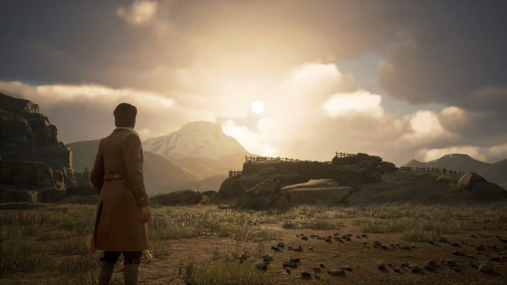 A person in a brown coat looks toward a cloudy sunset over rocky hills and a distant mountain, evoking the magical landscapes of Hogwarts Legacy.
