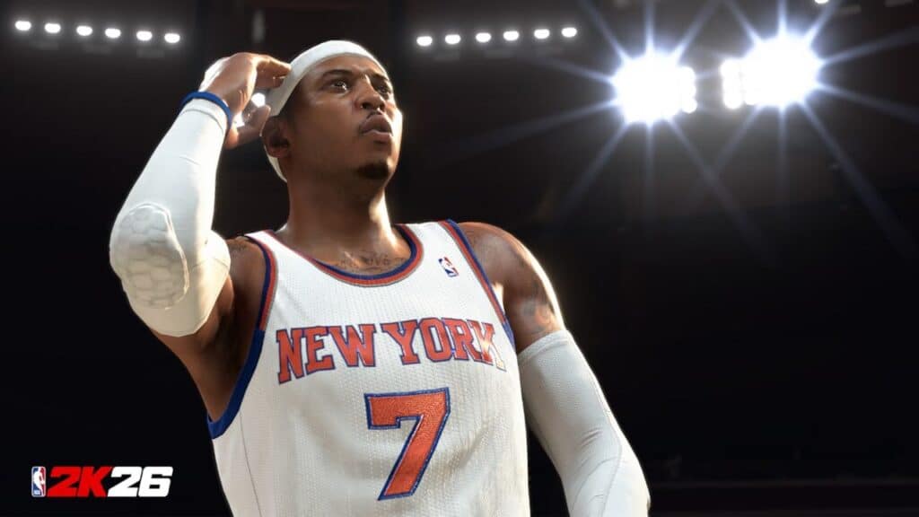 A basketball player in a New York Knicks jersey stands under bright lights, ready for action, with the NBA 2K26 logo shining in the corner.