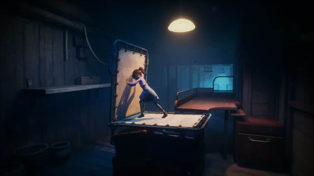 A girl in a blue dress pushes open a trapdoor in a dimly lit, cluttered room, revealing something in the video game Out of Sight.