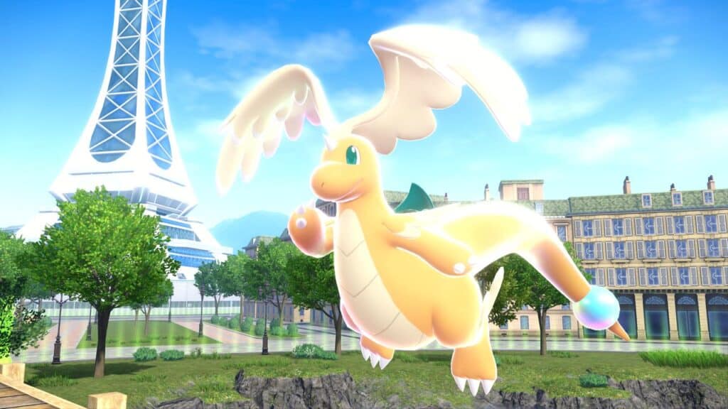 A shiny Dragonite with glowing wings floats near trees and buildings under a blue sky, hinting at surprises coming in Pokémon Presents July 2025 in Pokemon Legends Z-A.