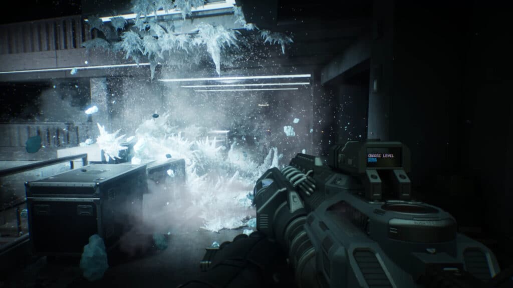 A futuristic gun fires, causing an icy explosion in a dark, industrial environment reminiscent of RoboCop Rogue City: Unfinished Business.