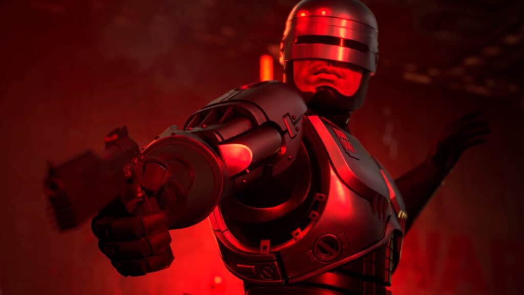 A robotic police officer, from RoboCop Rogue City: Unfinished Business, aims a gun, illuminated by red light in a dark setting.