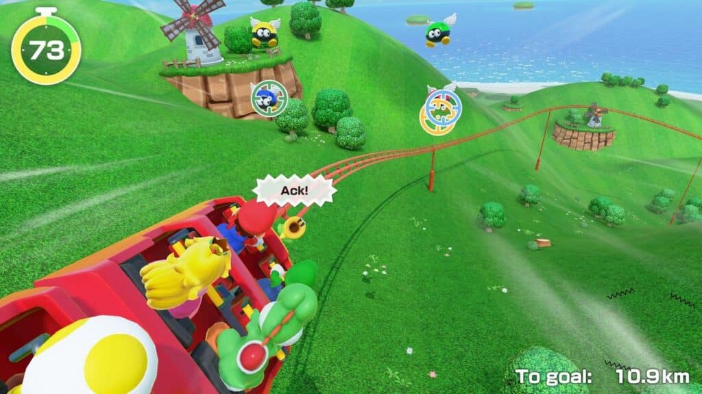 A colorful rollercoaster with cartoon characters, inspired by Super Mario Party Jamboree, rides through a green, hilly landscape filled with targets and buzzing bees.