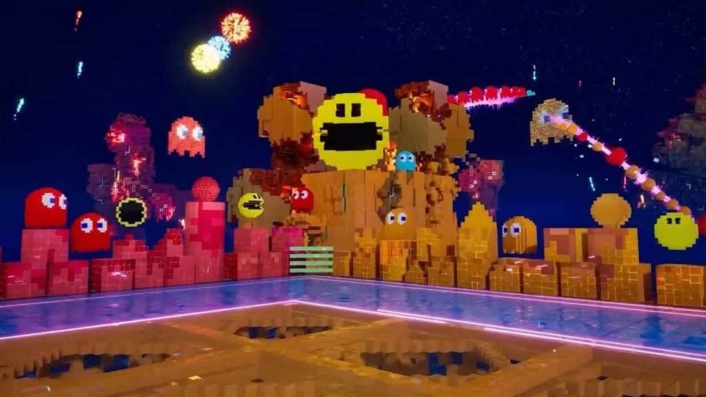 Pixel art Pac-Man and ghosts with fireworks in a colorful, blocky landscape at night, reflecting on water—celebrating gaming icons from TEKKEN 8 Summer DLC to classic arcade legends.