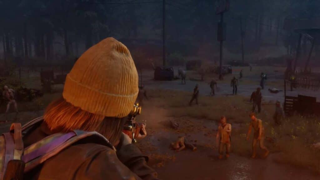 In State of Decay 3, a person with a yellow beanie aims a gun at zombies in a dark, abandoned outdoor area, reminiscent of the tense atmosphere following the recent Xbox layoffs.