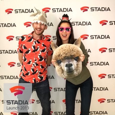 Chris and Grace in playful costumes pose in front of a STADIA launch 2019 backdrop, channeling the excitement of the launch of Google Stadia.
