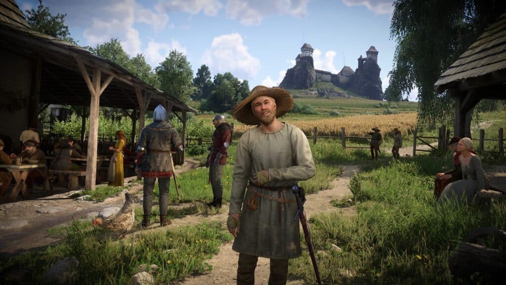 A smiling man in medieval clothing stands in a village with a castle visible in the background, evoking the immersive worlds found in Kingdom Come: Deliverance II on GOG games on Amazon Luna.