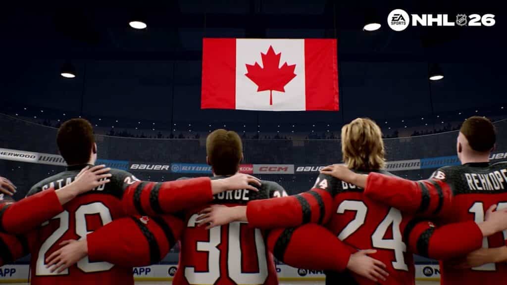 Hockey players in red jerseys link arms, facing a Canadian flag in an arena, reminiscent of a scene from EA Sports NHL 26.