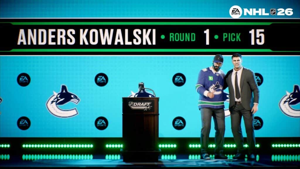 Two men pose on stage after an NHL draft pick, showing "Anders Kowalski, Round 1, Pick 15"—a moment soon to be relived in EA Sports NHL 26.