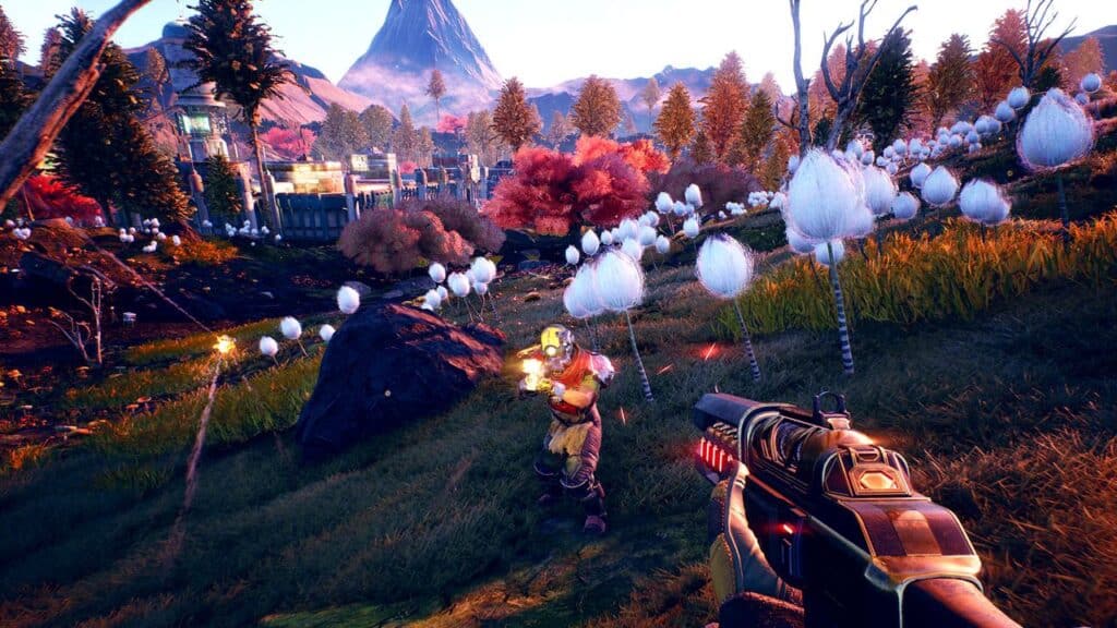 Experience The Outer Worlds, a first-person shooter scene set in a colorful, alien landscape with white puffy plants and mountains, inspired by the vibrant worlds found in GOG games on Amazon Luna.