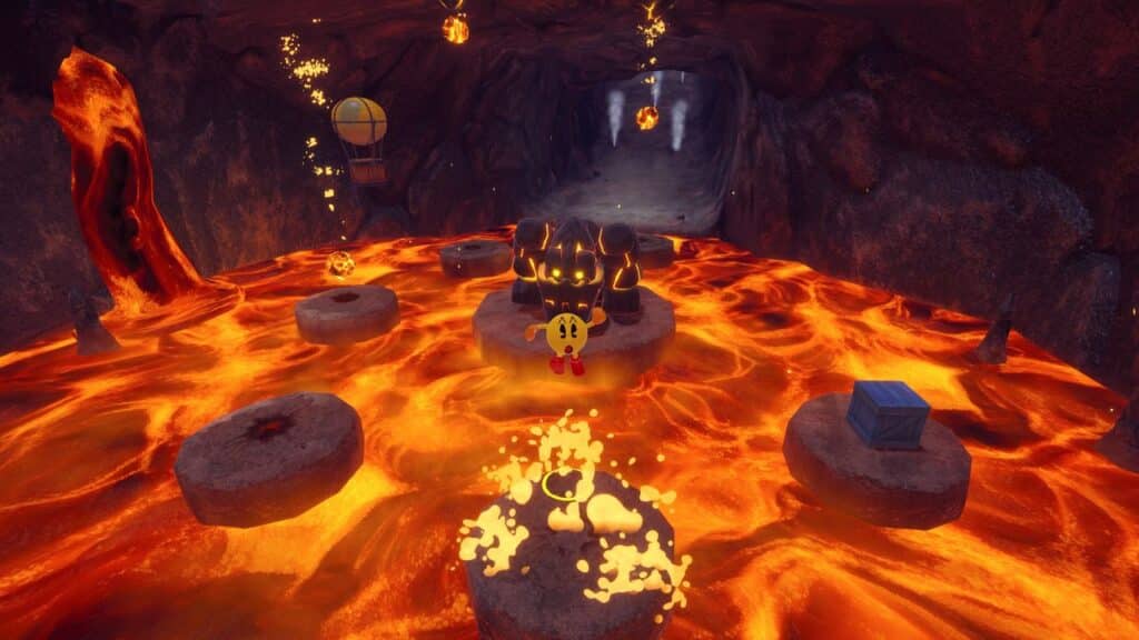 Pac-Man from Pac-Man World 2: Re-Pac stands on a stone platform above flowing lava in a fiery cave, surrounded by obstacles and collectibles.