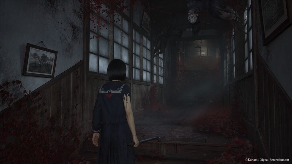 A girl in a school uniform stands in a dark, eerie hallway reminiscent of Silent Hill f, with hanging bodies and red petals scattered around.