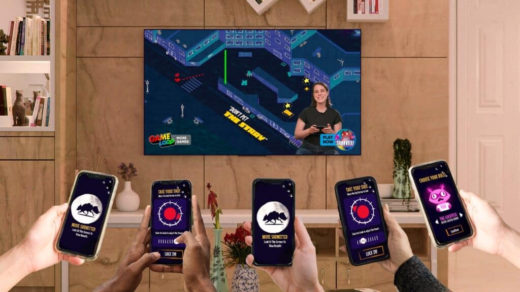 Four people hold phones showing trivia apps while a TV displays a game show with a female host and game graphics, highlighting the excitement of GAMELOOP Smart TV cloud gaming in a lively living room.