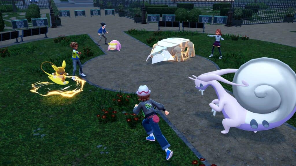 Four trainers battle with Pokémon, including Raichu, Slowpoke, Goodra, and Iron Moth, in a park setting inspired by Pokémon Legends Z-A.