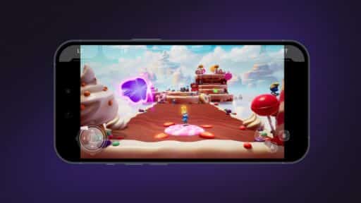 A mobile phone screen shows a colorful candy-themed platformer video game with a character jumping. Xsolla Cloud Gaming Adds Adds Virtual Gamepad Overlay for Mobile Play.
