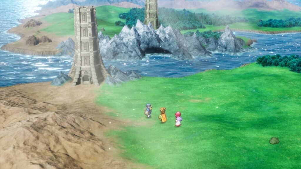 Three characters stand on grass near a tall tower, gazing at mountains and water under a bright sky in the vibrant world of Dragon Quest I & II HD-2D Remake.