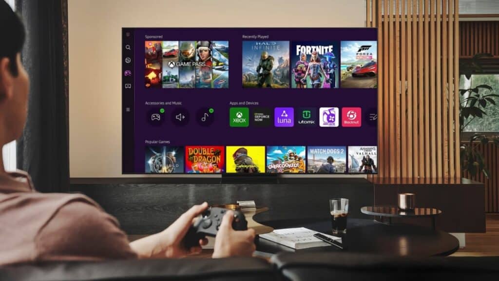 Person holding a game controller, facing a Smart TV displaying a gaming menu filled with various games and apps—offering a glimpse into the future of cloud gaming.