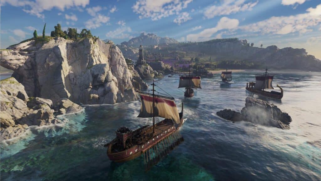 Several ancient ships sail near rocky cliffs and a coastline with mountains and lush greenery under a blue sky, evoking the maritime splendor of Anno 117: Pax Romana.