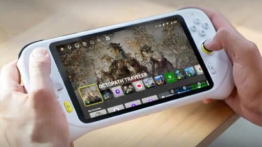 Person holding a white handheld gaming device showing the game "Octopath Traveler" on its screen.