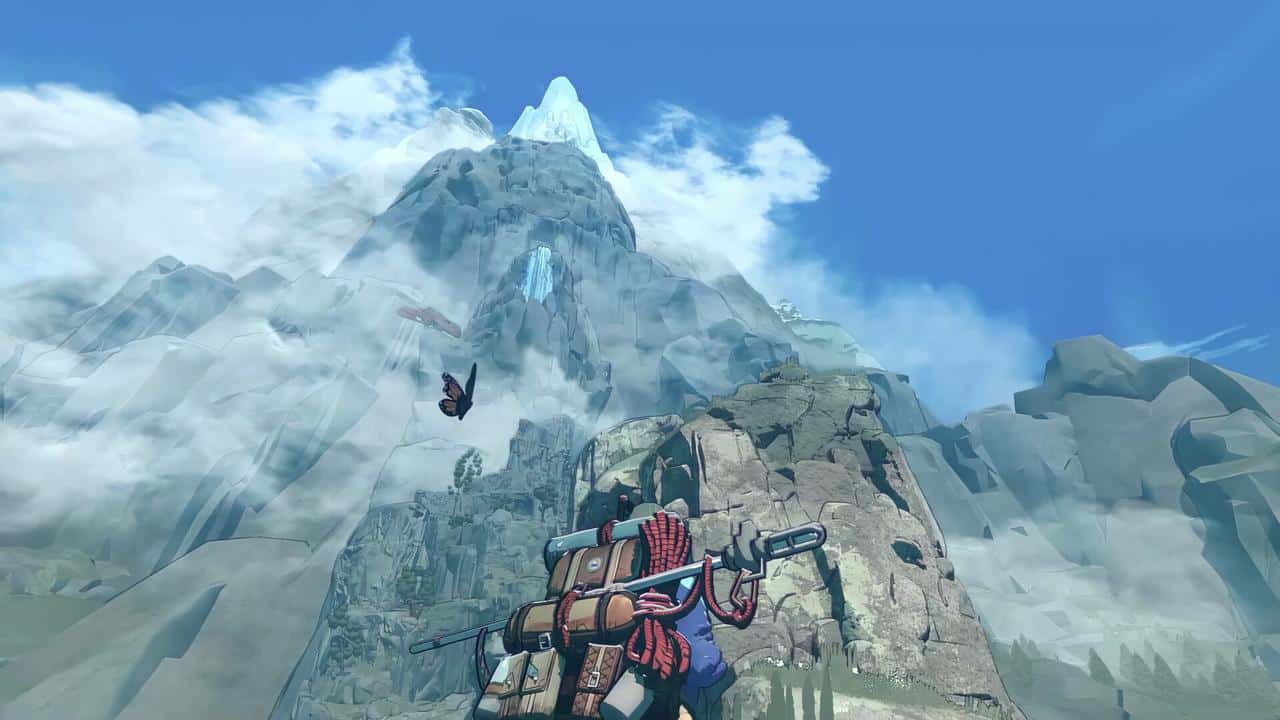 A climber with a red backpack stands beside a cairn, gazing up at a tall, snowy mountain peak surrounded by clouds and blue sky in Cairn.