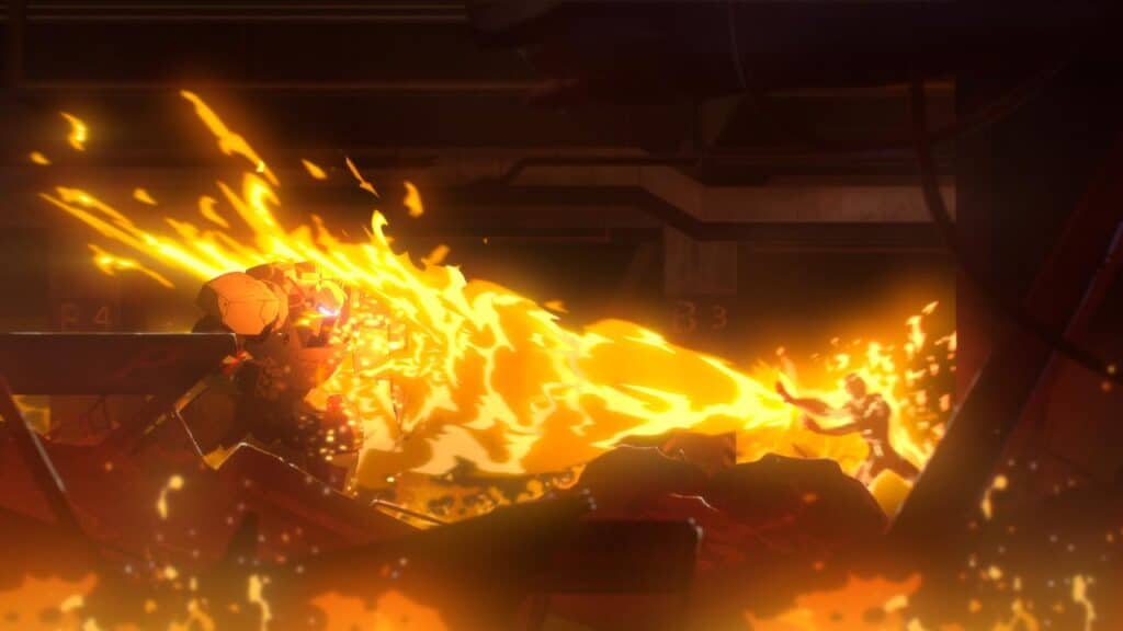 A person in armor shields themselves from a large stream of fire in a dark, fiery, industrial setting.