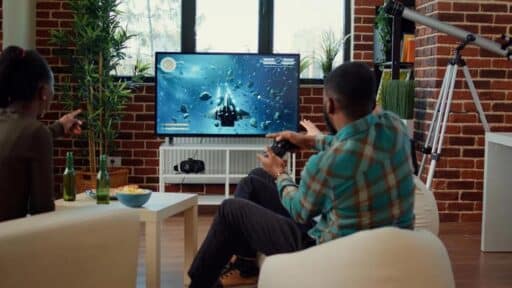 People playing a cloud game on a smart TV in a living room without a console