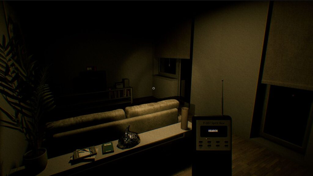 A dimly lit living room featuring a couch, a television stand, and a sprit box device on a table. A plant is visible to the left, and shadows create a mysterious atmosphere.