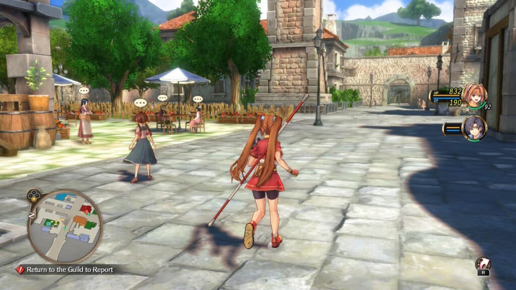 A character with long hair and a red outfit walks down a cobblestone street in a picturesque village. Other characters are seen in the background, interacting near tables and under umbrellas, with green trees and buildings lining the path.