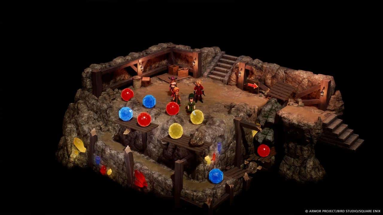 Two characters stand in a rocky cave room with colored orbs and scattered wooden furniture, evoking the adventurous spirit of DRAGON QUEST VII Reimagined.