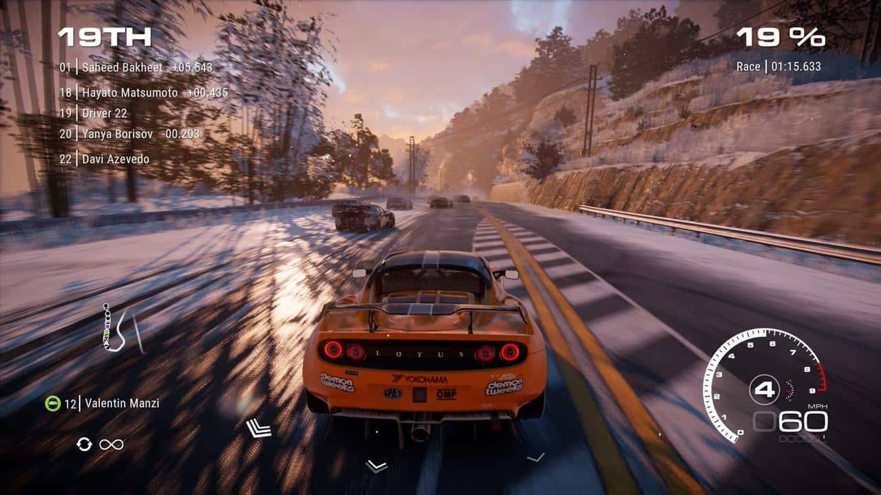 A yellow sports car races on a snowy road with other cars ahead in GRID Legends: Deluxe Edition; speed and race stats are shown onscreen.