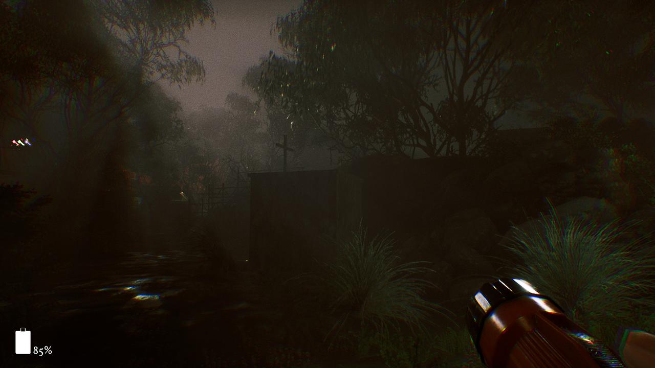 A dark, foggy forest unfolds under the eerie glow of a flashlight beam, a low battery icon warning in the corner—a perfect setting inspired by The 9th Charnel.