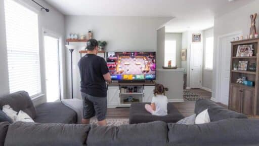 Cloud gaming on a smart TV in a living room with a game already in progress.