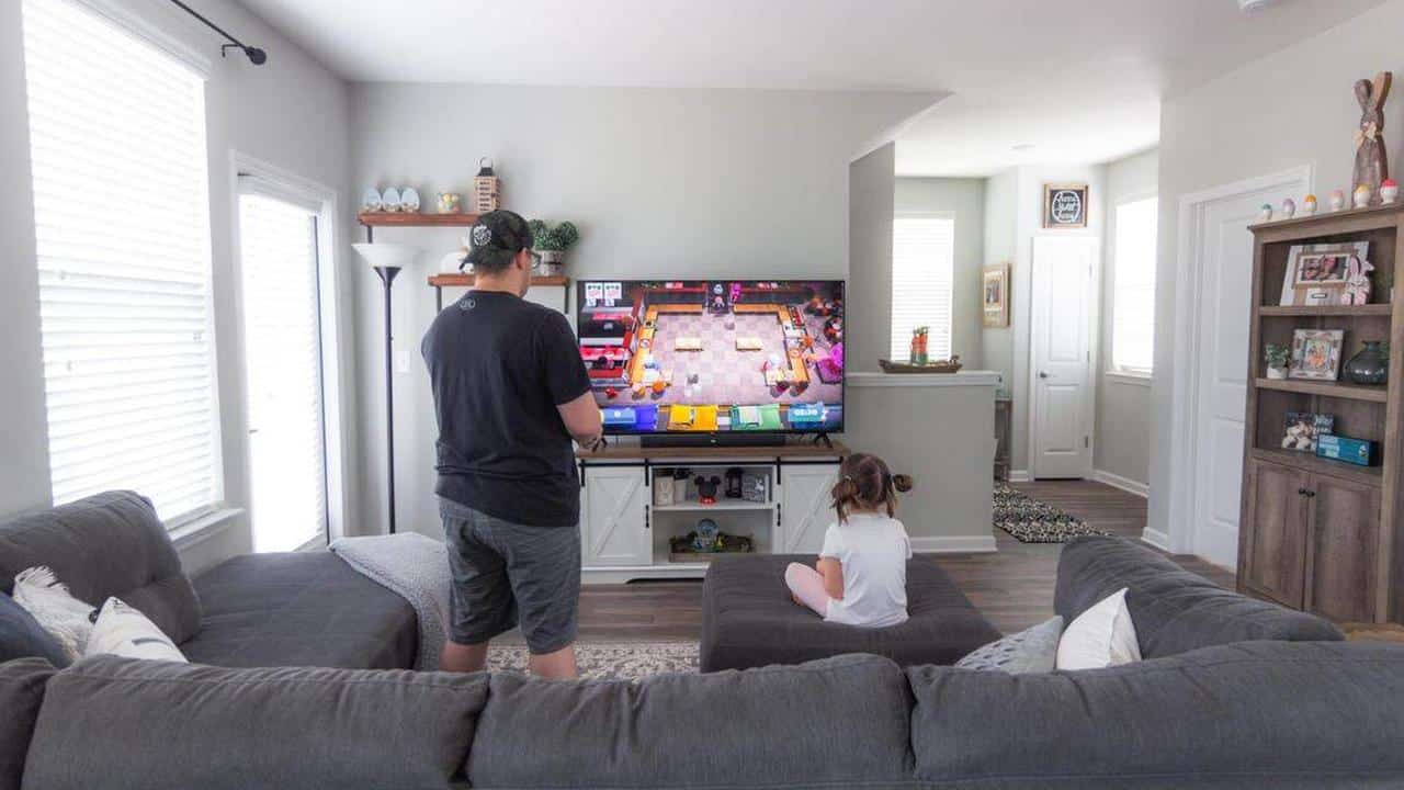 Cloud gaming on a smart TV in a living room with a game already in progress.