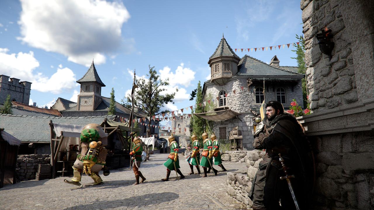 A hooded man with a sword hides in a Crimson Desert village as soldiers march through medieval stone streets under a blue sky.