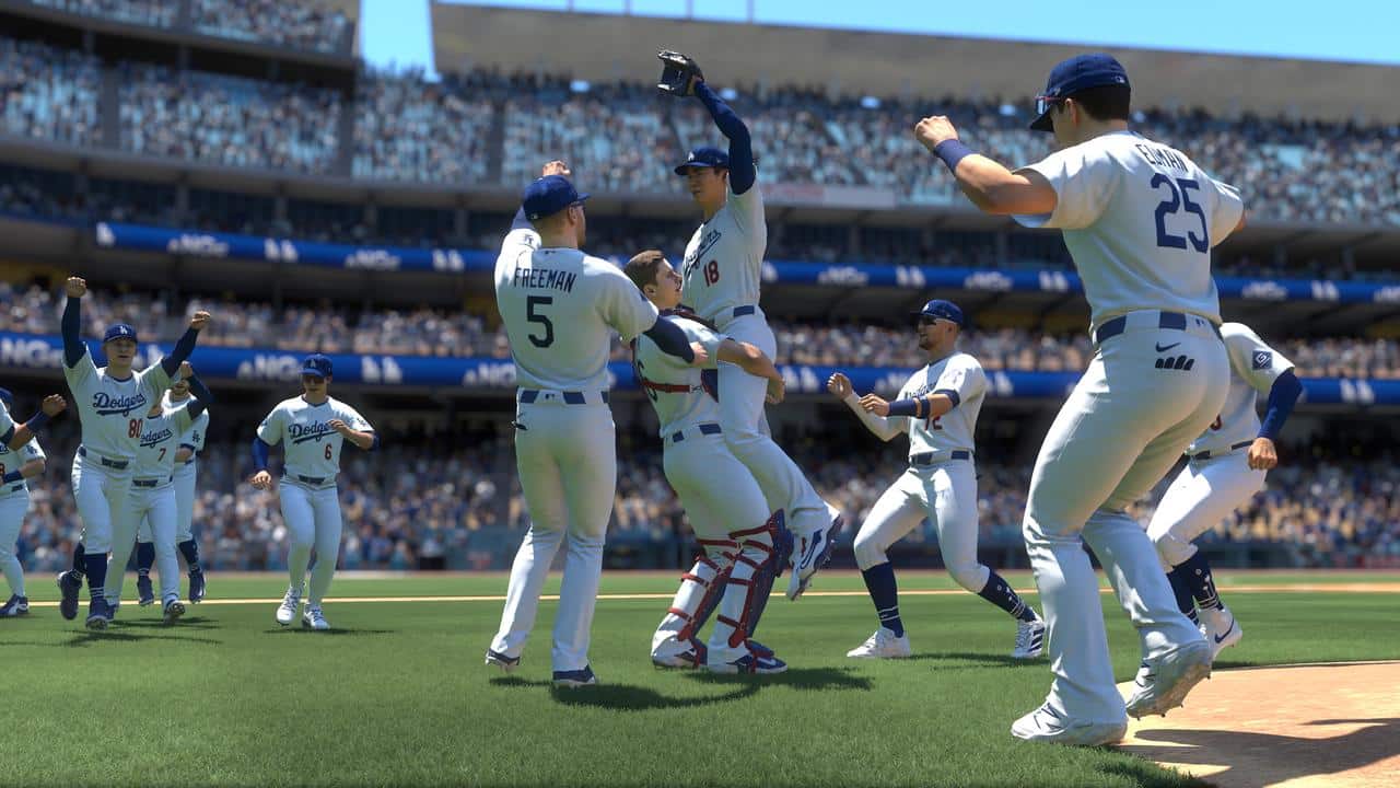 Baseball players in white uniforms celebrate on the field as a crowd cheers in a stadium, capturing the excitement often seen in MLB The Show 26.