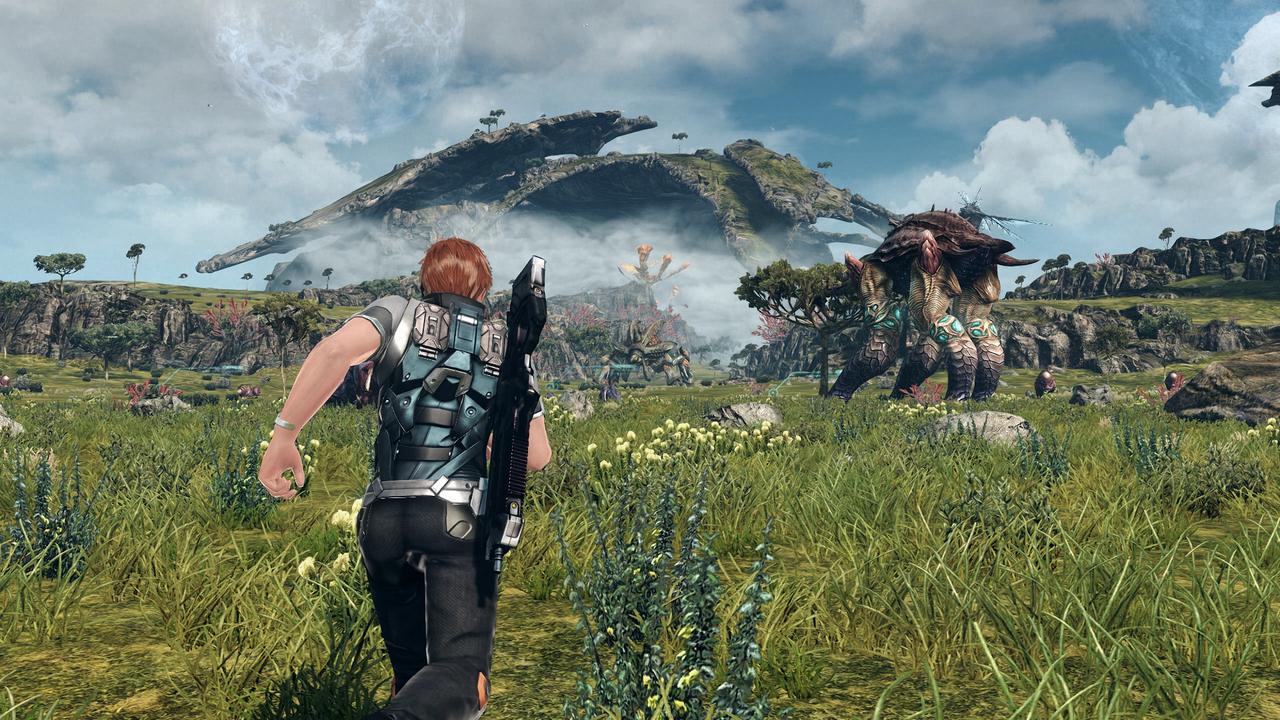 A person with a gun runs toward giant alien creatures on a grassy plain under a cloudy sky in Xenoblade Chronicles X: Definitive Edition – Nintendo Switch 2 Edition.