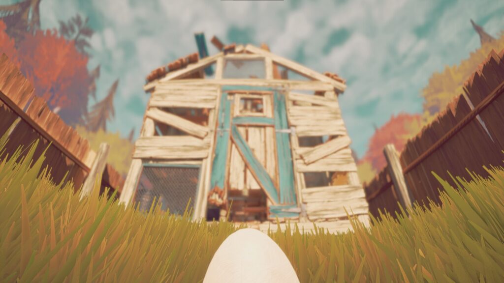 View of a rundown wooden shed and a white egg on grass, with a blue sky and trees in the background.