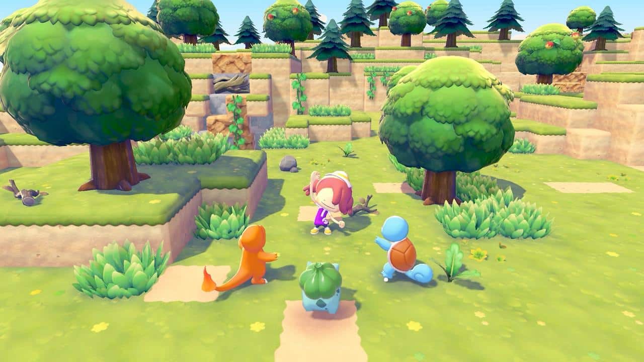 A character standing in a grassy area with Charmander, Bulbasaur, and Squirtle gathered around them in Pokémon Pokopia.