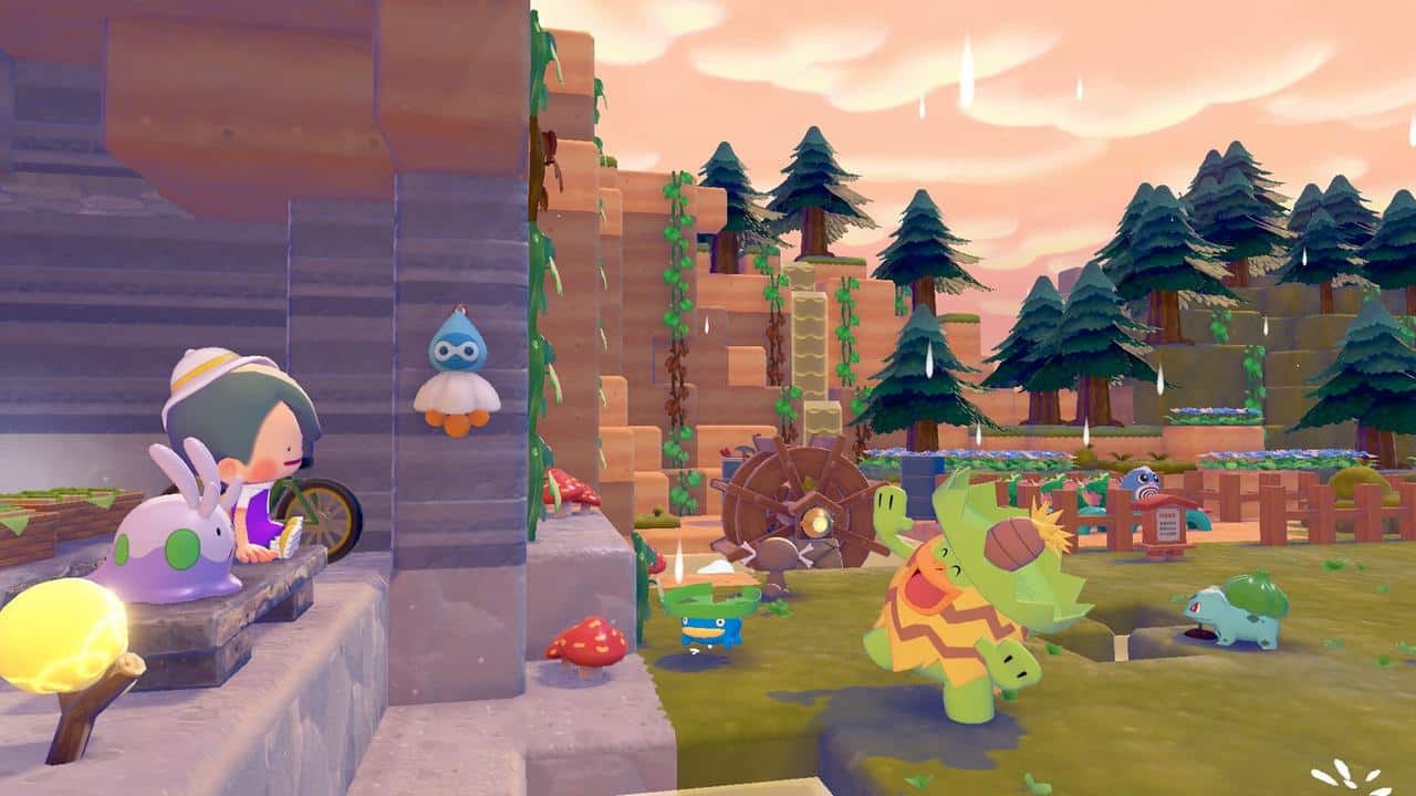 A character sitting on stone steps watching a busy habitat filled with Pokémon going about their routines at sunset in Pokémon Pokopia.