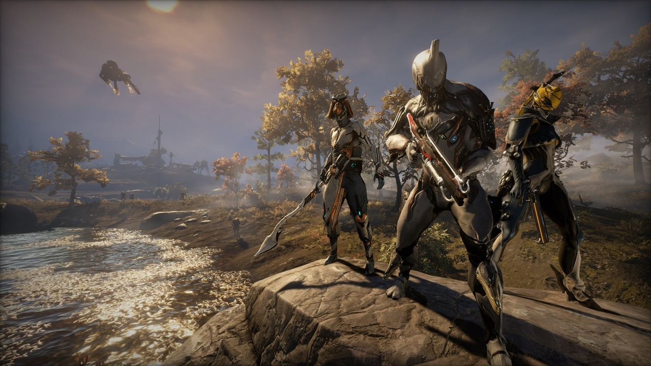 Three armored sci-fi characters with weapons stand on rocks by a river, with autumn trees and distant ships.