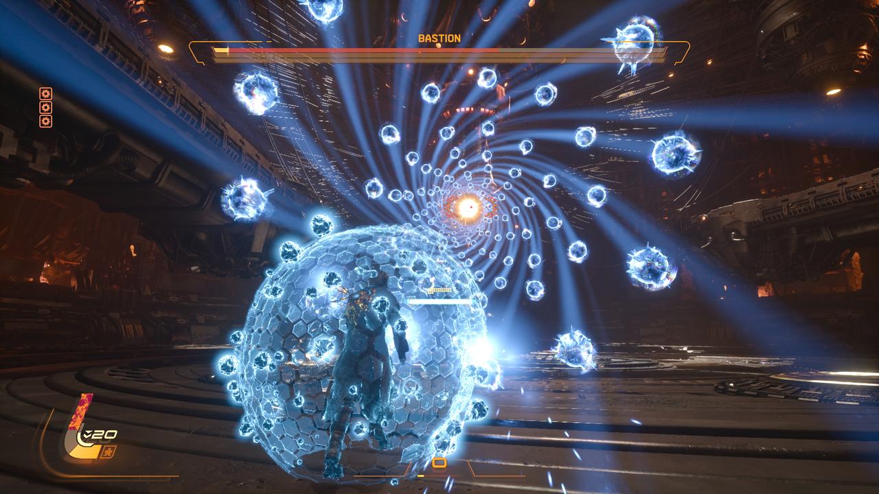 Arjun Devraj uses the blue Soltari Shield to absorb a spiral pattern of projectiles during a high-intensity boss fight against Bastion.