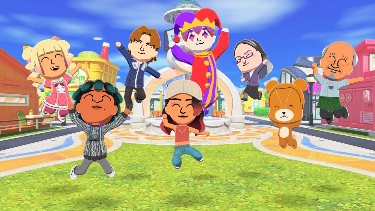 A group of colourful Mii characters jumping together in front of the fountain on Good Vibes Island in Tomodachi Life: Living the Dream.