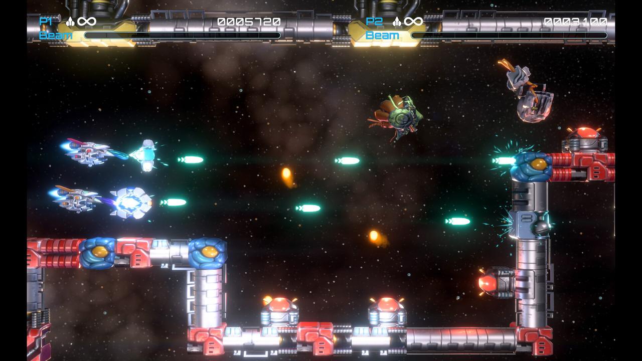 R-Type Dimensions III gameplay screenshot displaying two-player local co-op, with both ships actively utilizing Force pods to clear environmental hazards and enemies.