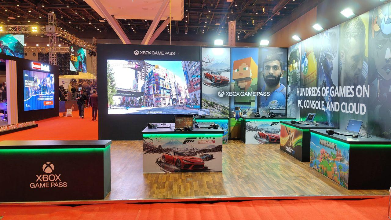 The Xbox Game Pass booth at Mumbai Comic Con 2026 featuring demo stations for Forza Horizon 6, Minecraft, and Cricket 24 under a banner promoting hundreds of cloud games.