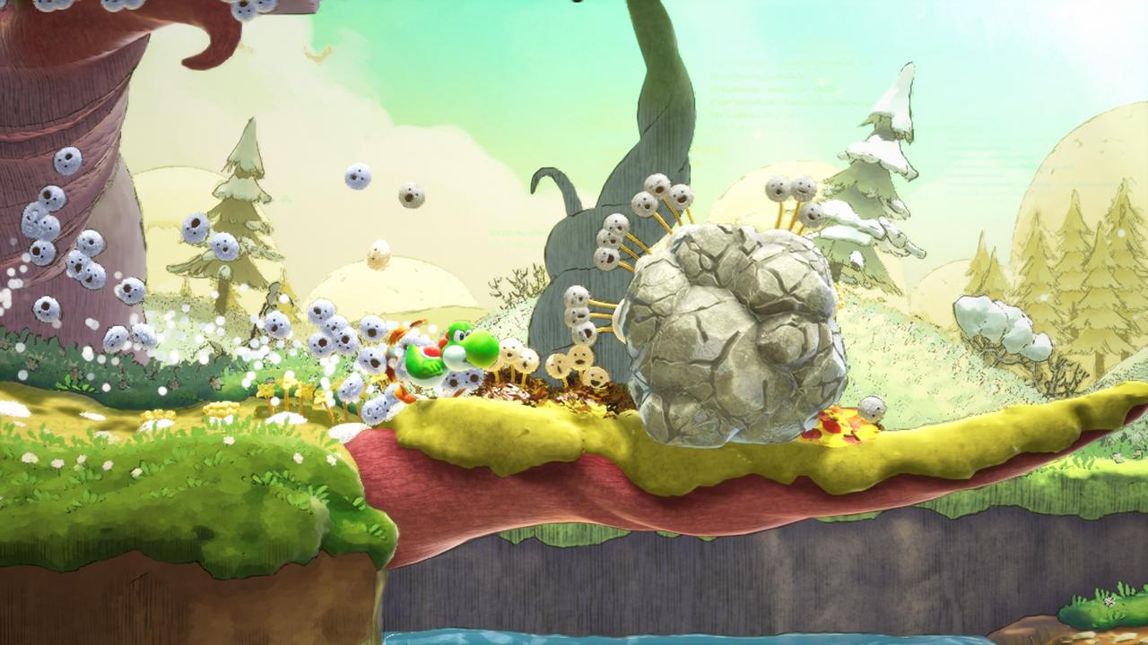 Yoshi moves through a forest page filled with fuzzy creatures and a large stone creature in Yoshi and the Mysterious Book.
