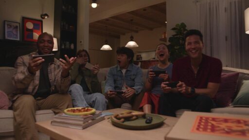 Group of people using phones as controllers while playing Amazon Luna GameNight on a TV.