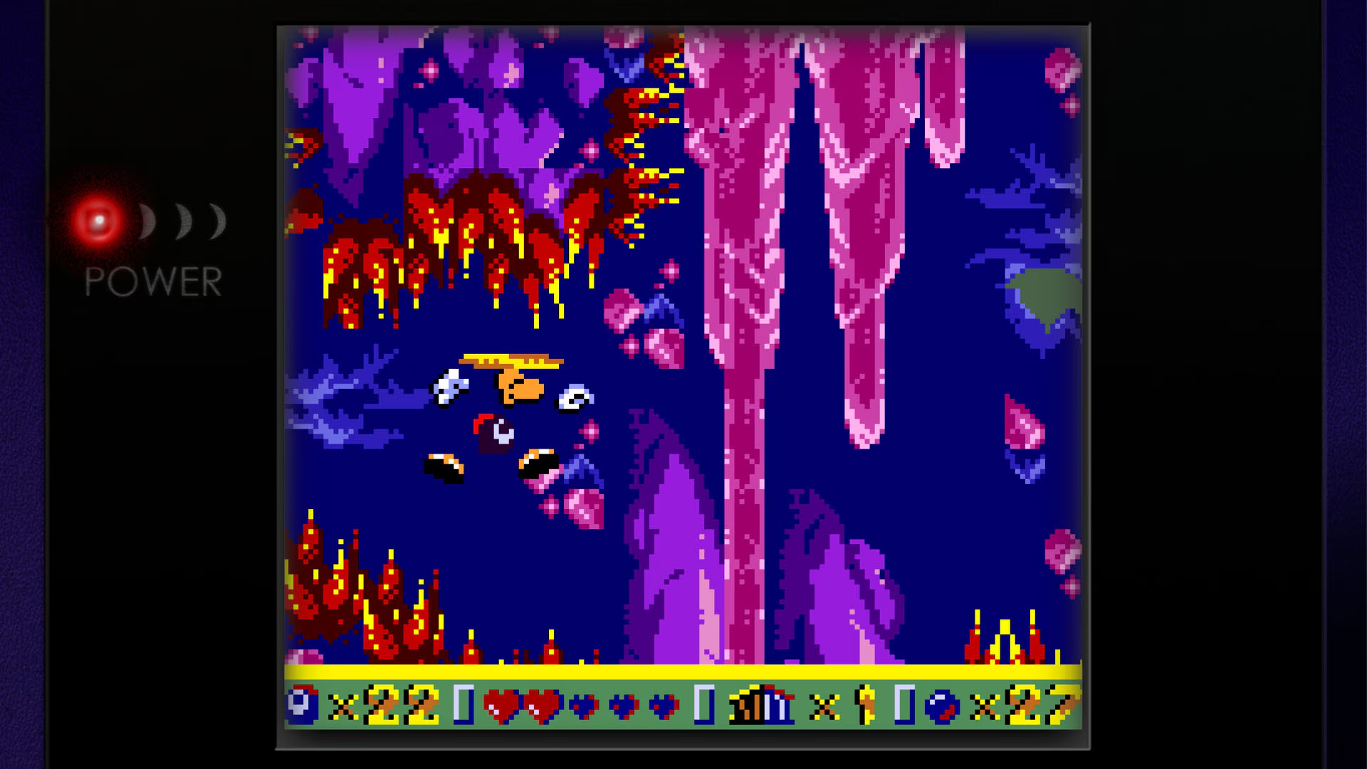 Pixel art side-scrolling video game scene featuring a spaceship navigating a colorful cavern with stalactites, lava, and game status bar showing lives and collectibles
